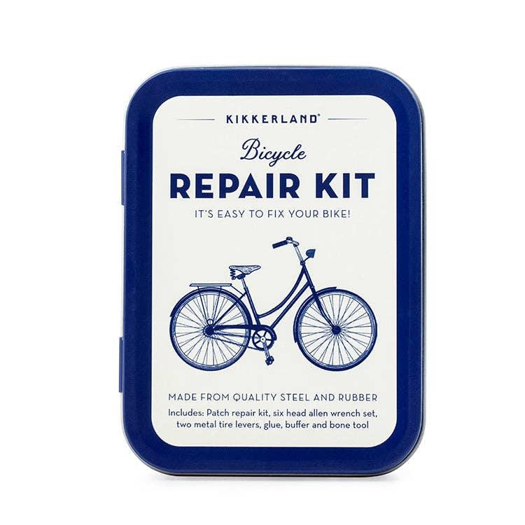 Kikkerland bicycle repair kit in blue tin with tools for fixing bike tires and tubes