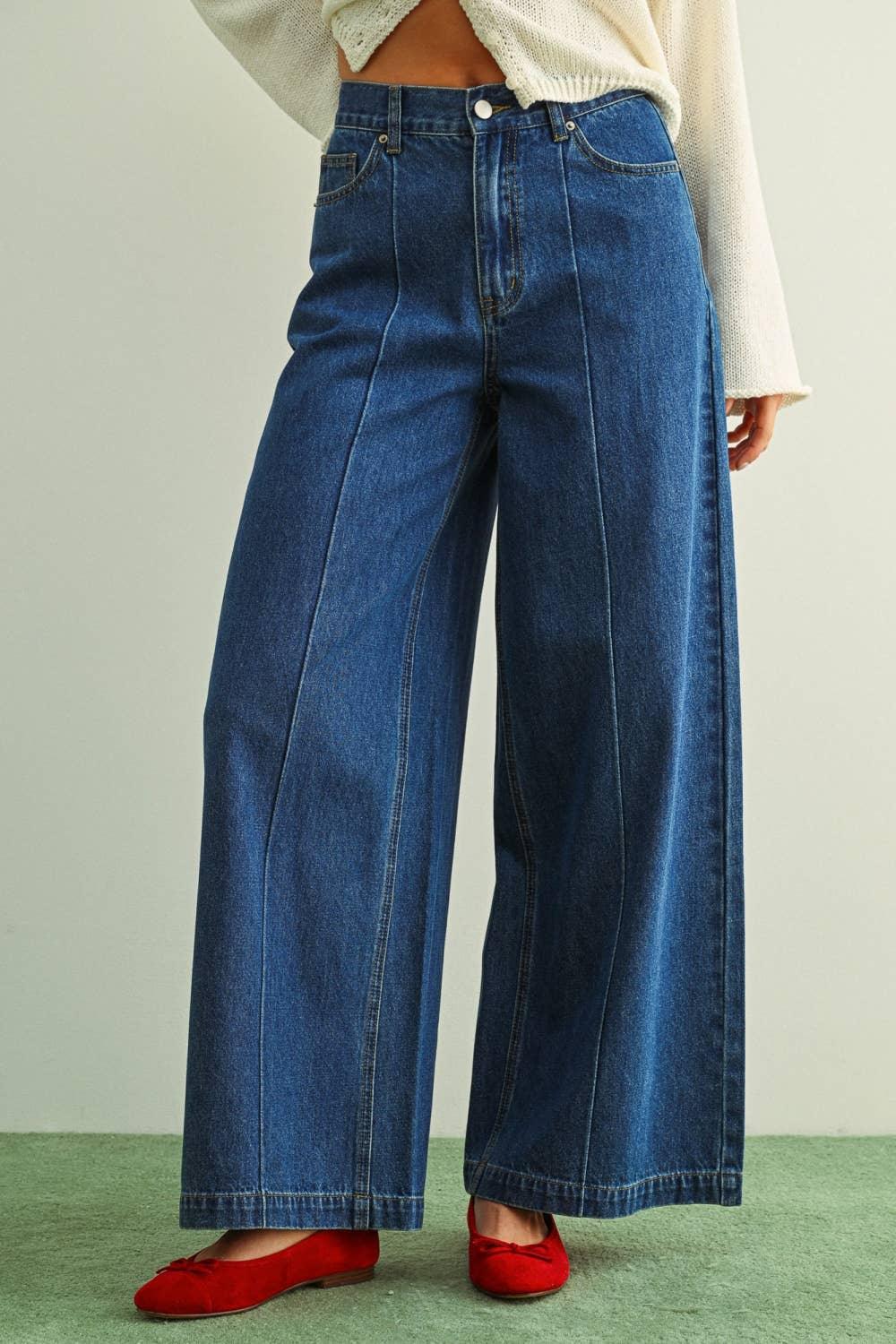 High-waisted wide-leg denim jeans with red flats, styled for casual comfort