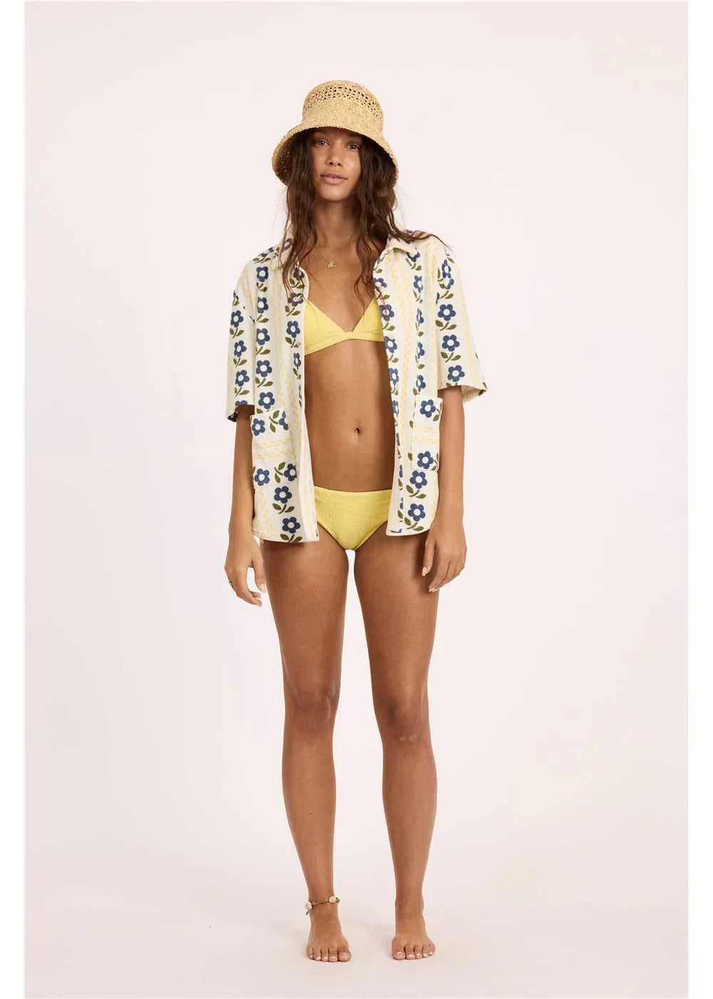 Yellow bikini with floral cover-up and straw hat for beach days and coastal style