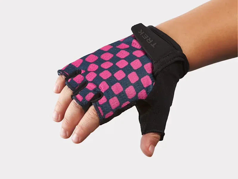 Pink and navy checkered fingerless bike glove with Trek logo, ideal for cycling adventures