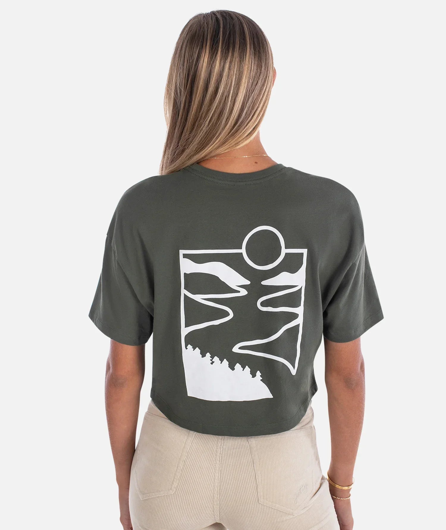 Olive green crop tee with white abstract mountain and sun graphic, perfect for PNW outdoor adventures.