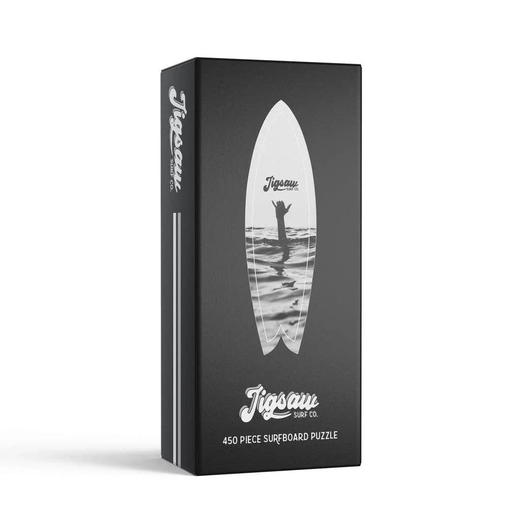 450-piece surfboard puzzle by Jigsaw Surf Co. with ocean wave design