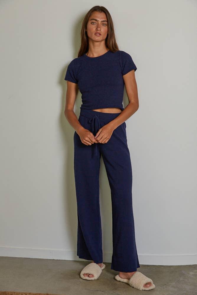 Navy blue cropped tee and wide-leg lounge pants with cozy slippers, perfect for coastal PNW style.