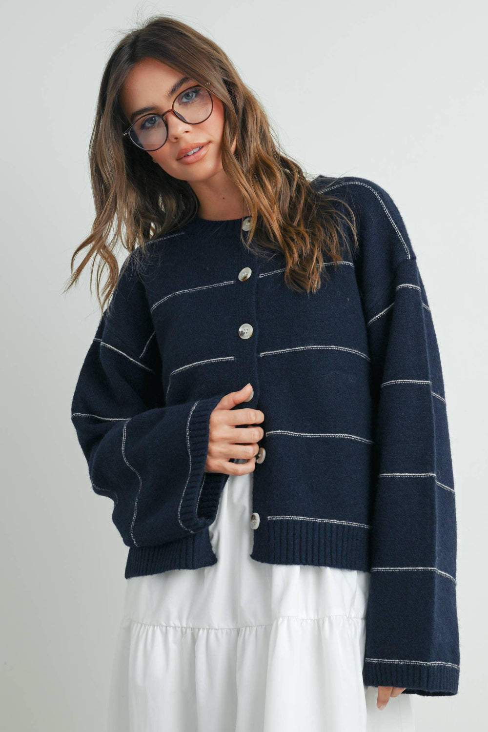 Navy striped button-up cardigan with cozy knit texture, perfect for PNW coastal style and everyday wear.