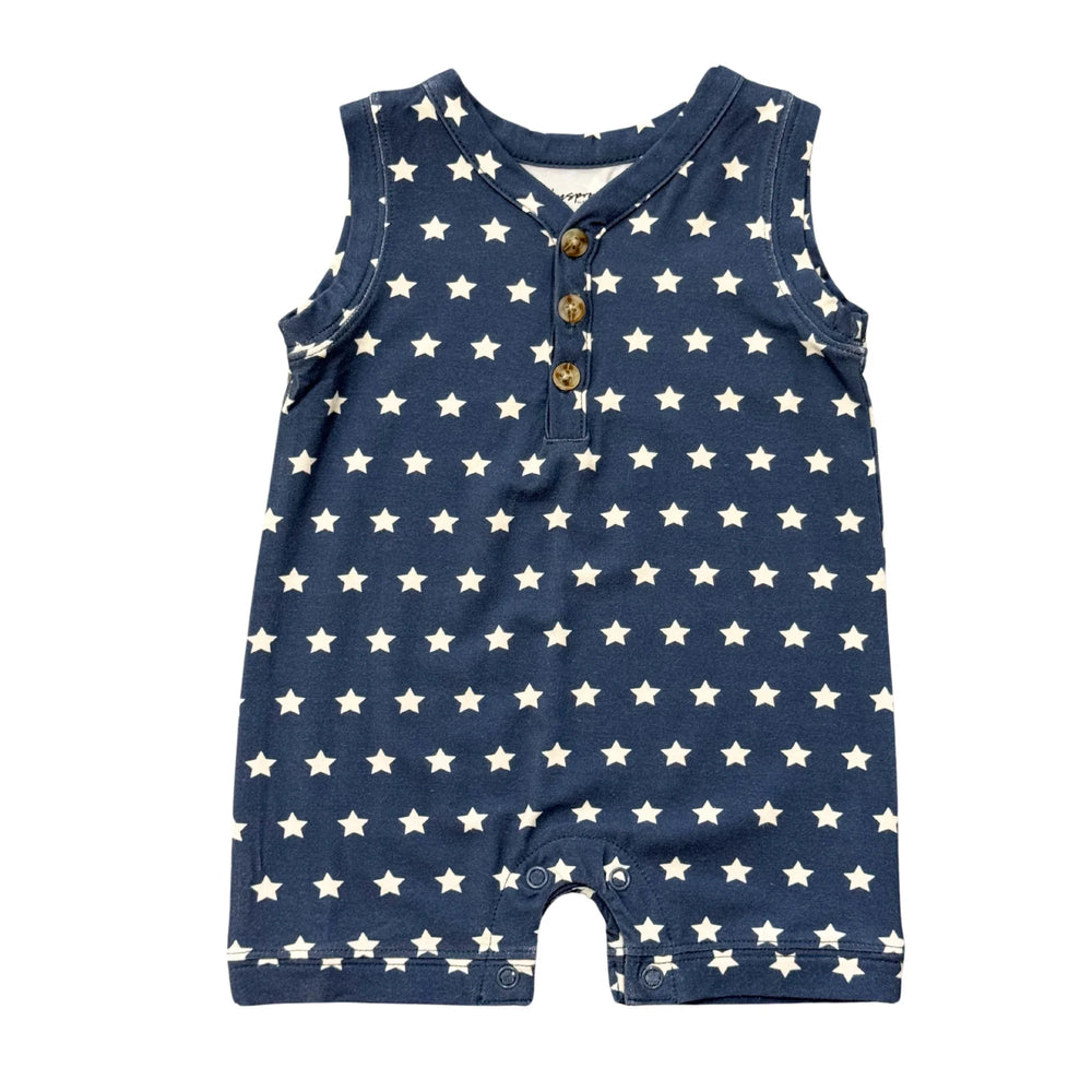 Navy blue baby romper with white star print, sleeveless design, and front buttons for easy dressing.
