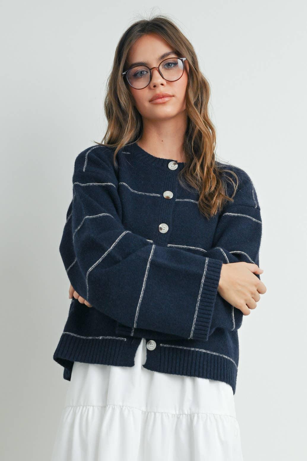 Navy blue striped cardigan with white contrast stitching, button front, cozy knit for coastal style