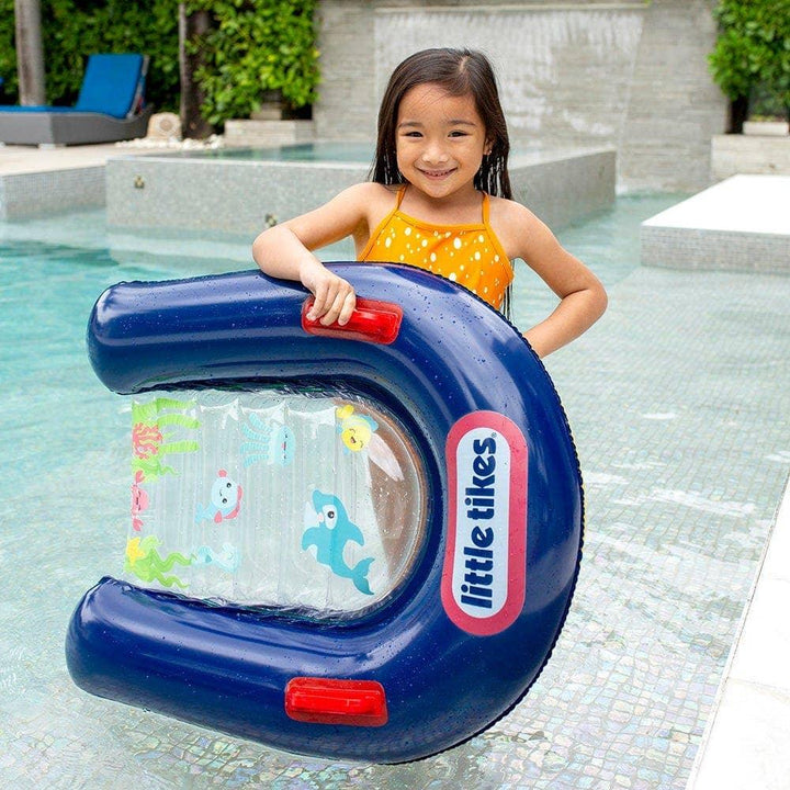 Little Tikes inflatable pool float with ocean theme, child smiling by poolside