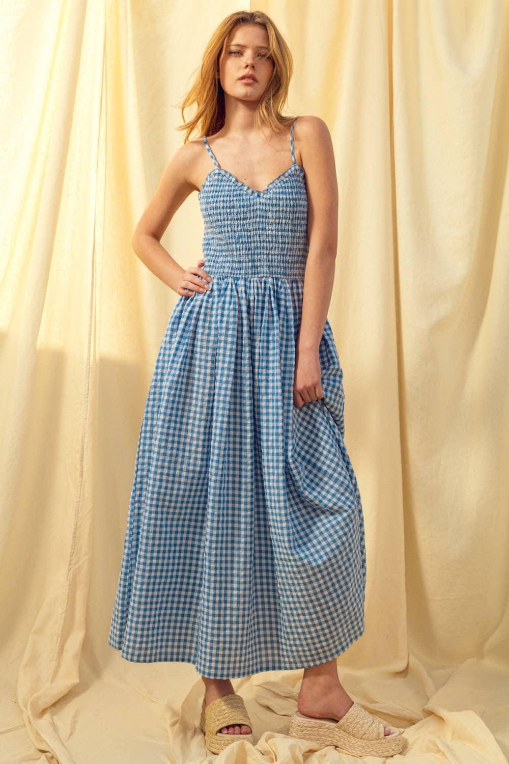 Blue gingham maxi dress with smocked bodice and spaghetti straps, paired with espadrille sandals
