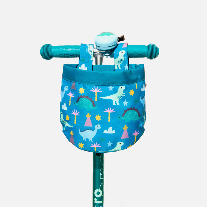 Blue dinosaur-patterned bike basket with matching bell on teal handlebars, perfect for kids&