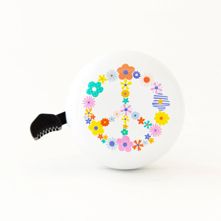 White bike bell with colorful floral peace sign design, perfect for coastal bike rides and outdoor adventures.