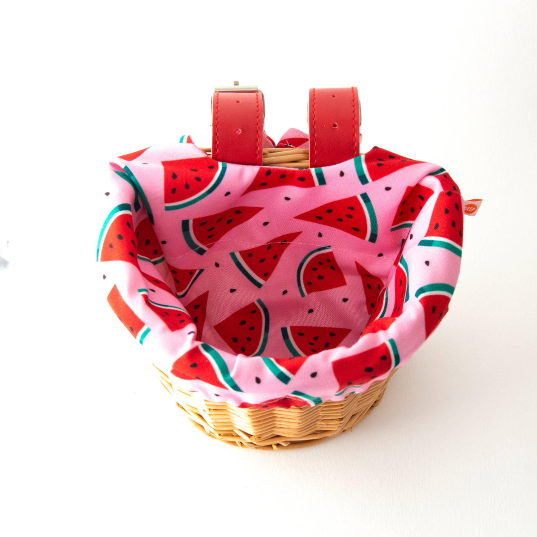 Watermelon-patterned bike basket liner with red straps for coastal adventures