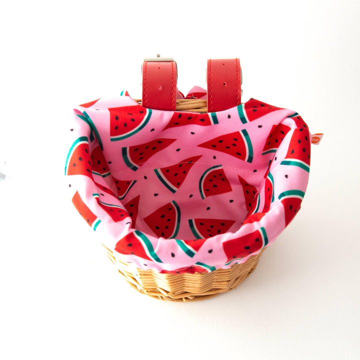Watermelon-patterned bike basket liner with red straps for coastal adventures