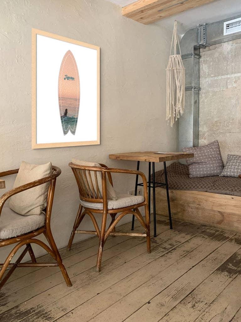 Framed Jigsaw Surf Co. Paddle Out surfboard puzzle art in a coastal room setting
