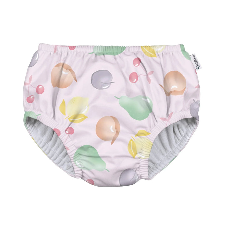 Fruit-patterned baby swim diaper with peaches, pears, and cherries on soft pink fabric
