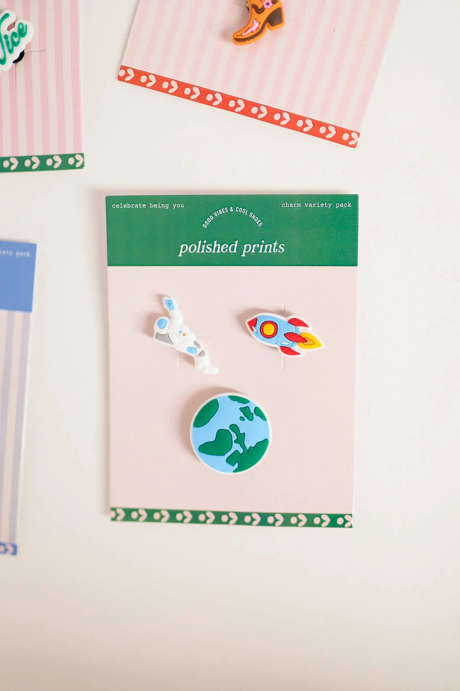 Polished Prints charm variety pack with astronaut, rocket, and Earth pins for outdoor adventure style