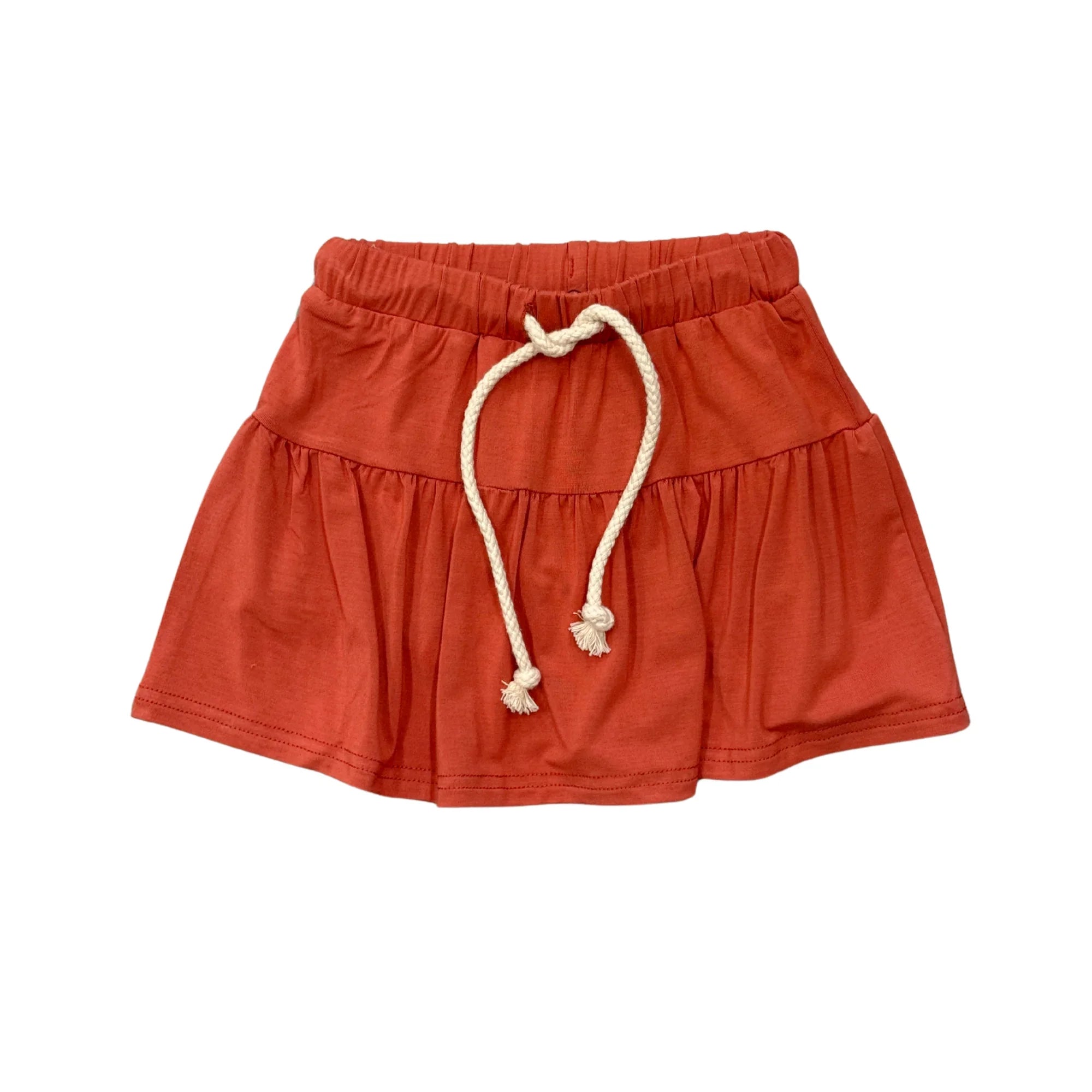 Rust-colored kids' drawstring skirt with ruffle hem, perfect for beach days and coastal adventures.