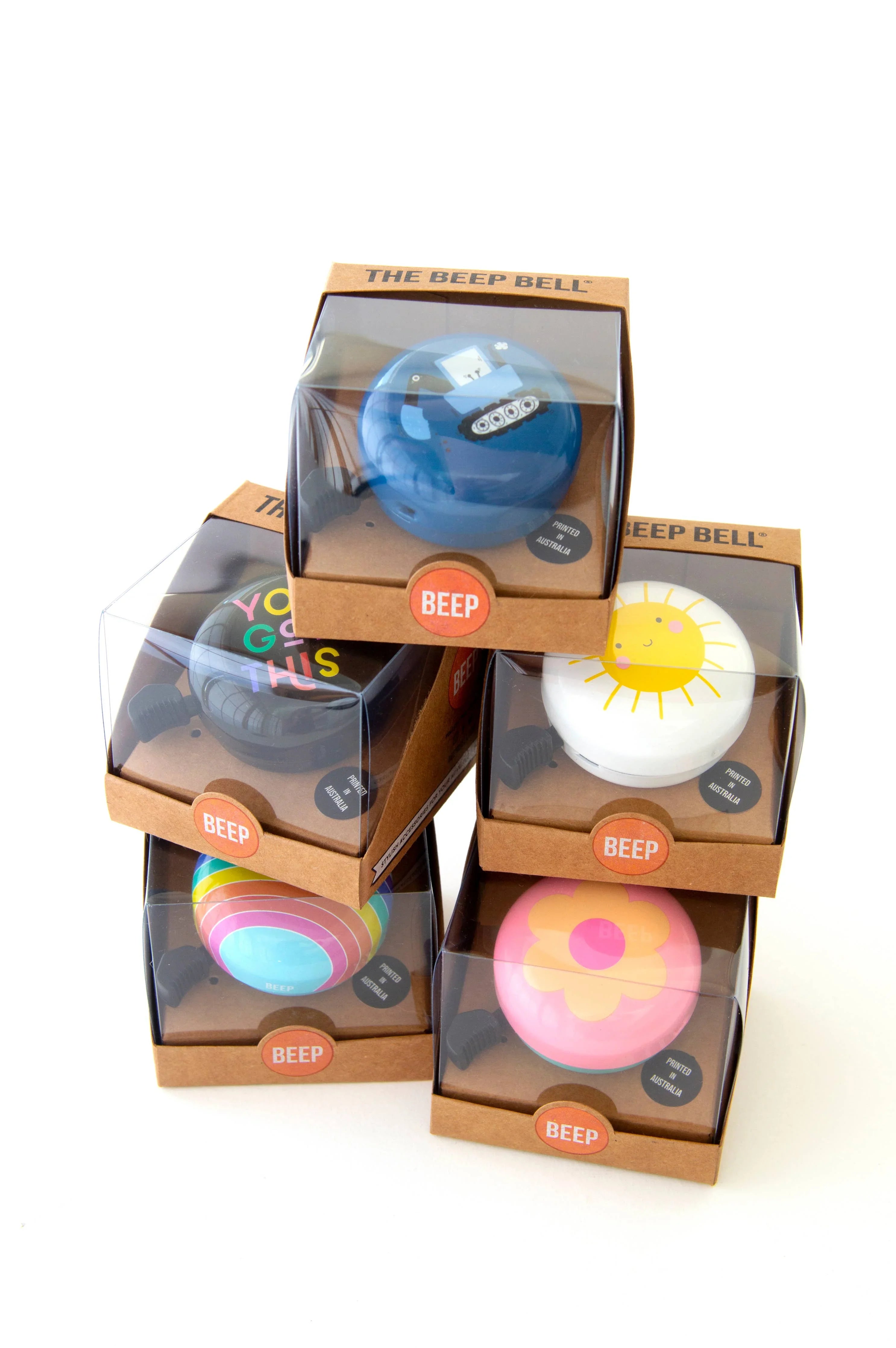 Colorful Beep Bell bike accessories in retail boxes, perfect for outdoor adventures and coastal style.