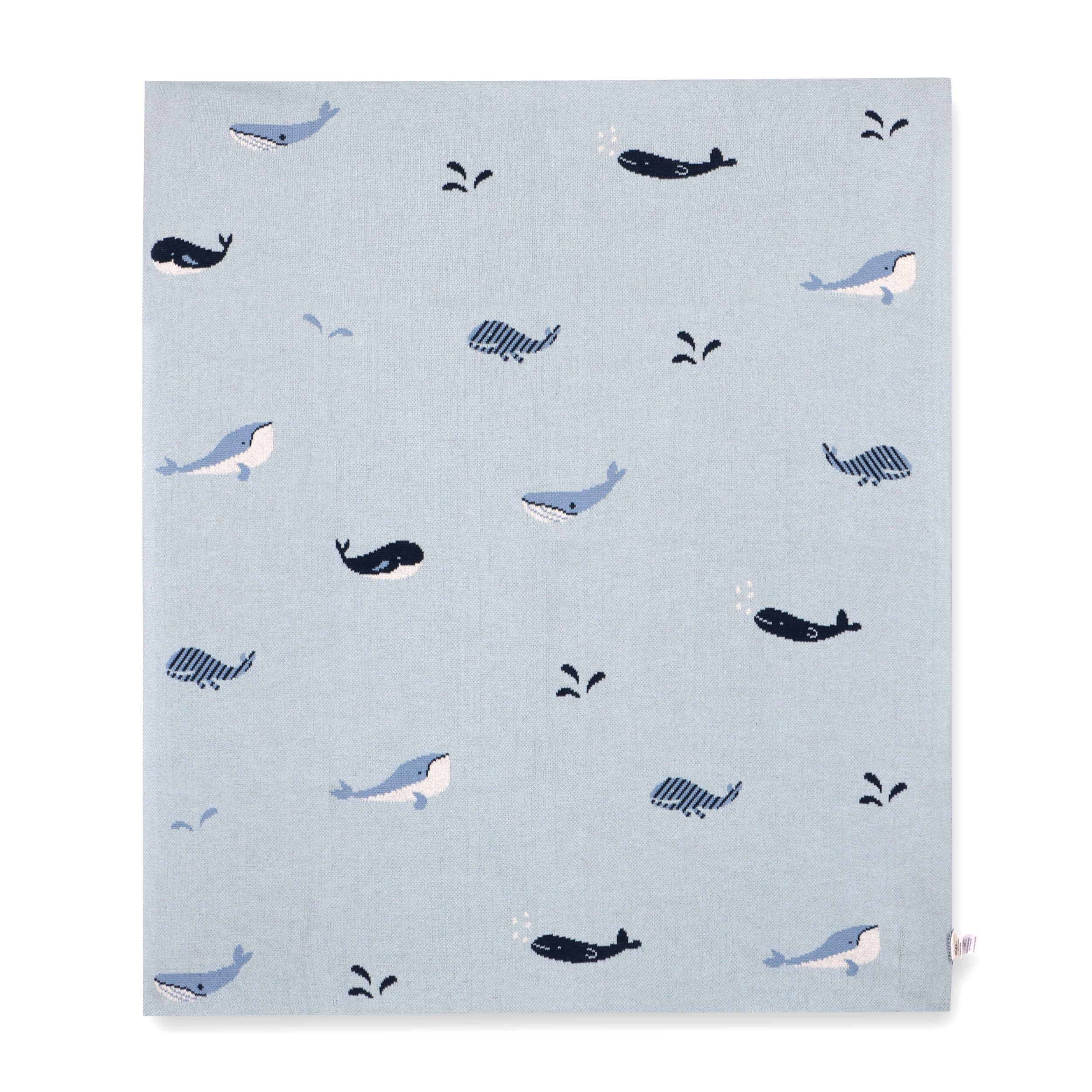 Light blue blanket with playful whale and splash patterns, ideal for baby nurseries or ocean-themed decor.