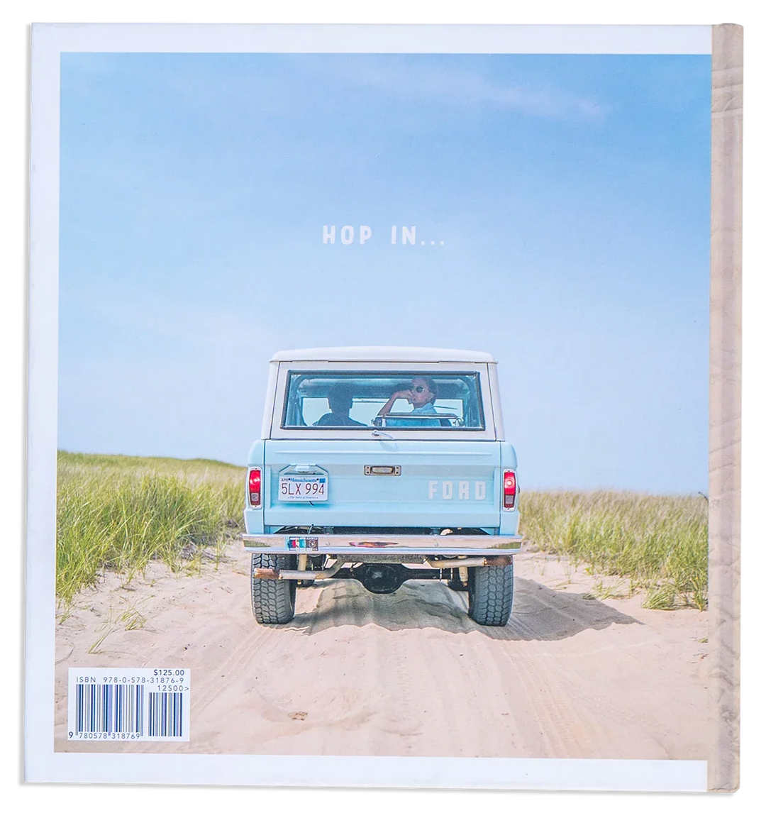 Vintage Ford Bronco on sandy beach dunes, &