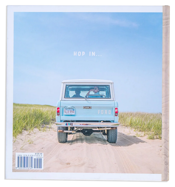 Vintage Ford Bronco on sandy beach dunes, &