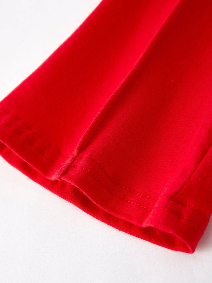 Vibrant red t-shirt hem with clean stitching, ideal for coastal adventures and everyday PNW style.