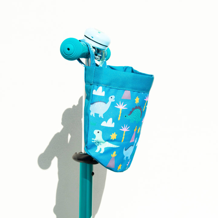 Blue dinosaur-print bike basket on scooter handlebars, perfect for kids&