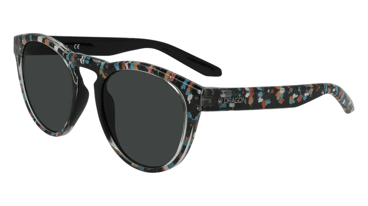 Stylish Dragon sunglasses with colorful speckled frames and dark lenses, perfect for outdoor adventures.