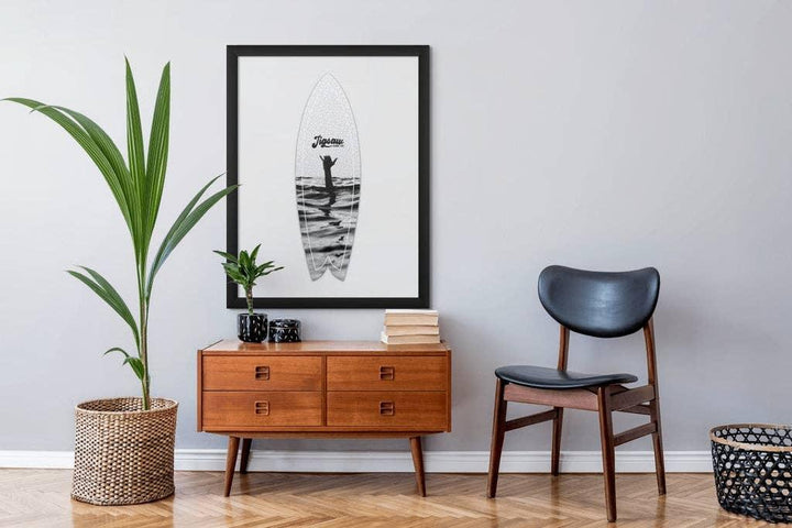 Surfboard art print with ocean waves, styled in modern living room decor