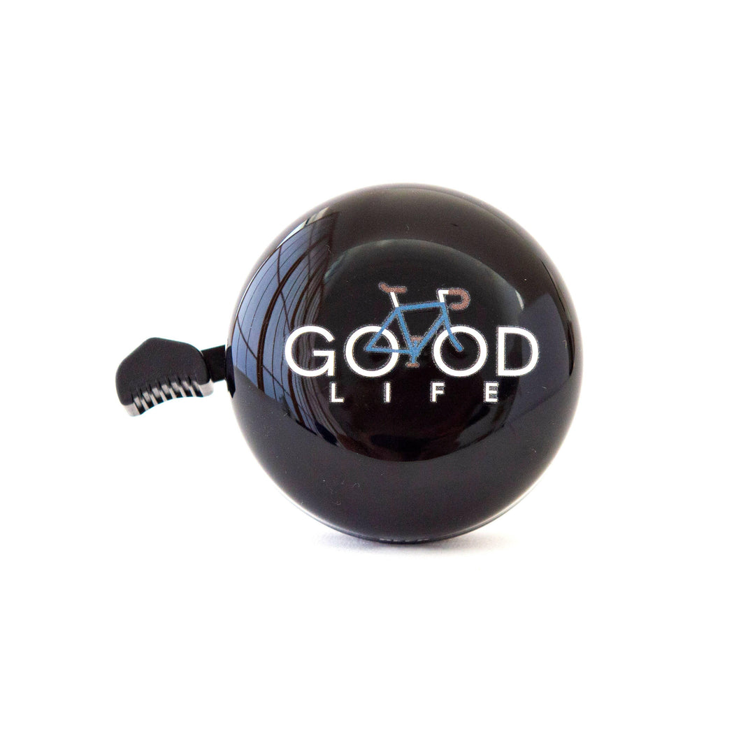 Black bike bell with 'GOOD LIFE' text and blue bicycle graphic, perfect for coastal rides and outdoor adventures.