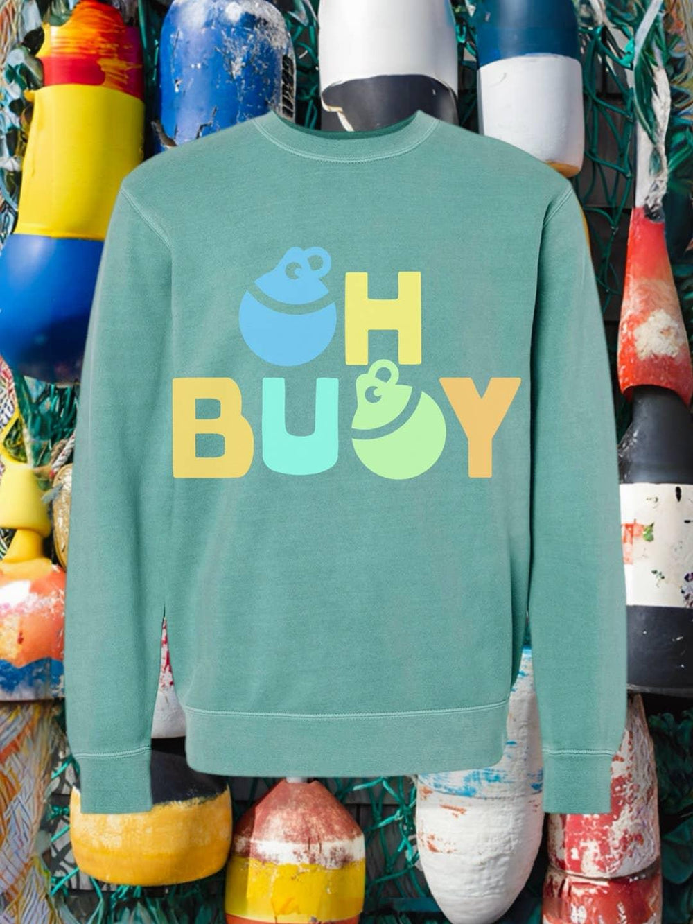 Coastal teal sweatshirt with 'Oh Buoy' graphic, nautical buoys background, PNW outdoor style
