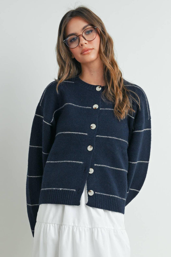 Navy striped button-up cardigan for coastal PNW style, paired with white skirt