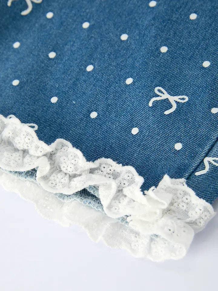 Denim shorts with white polka dots, lace trim, and bow details