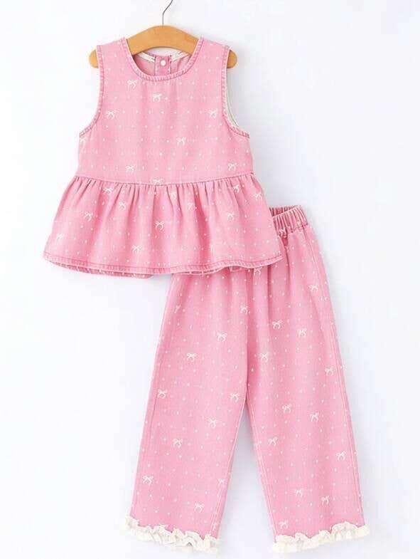 Pink bow-print toddler outfit with ruffled top and pants, perfect for casual play