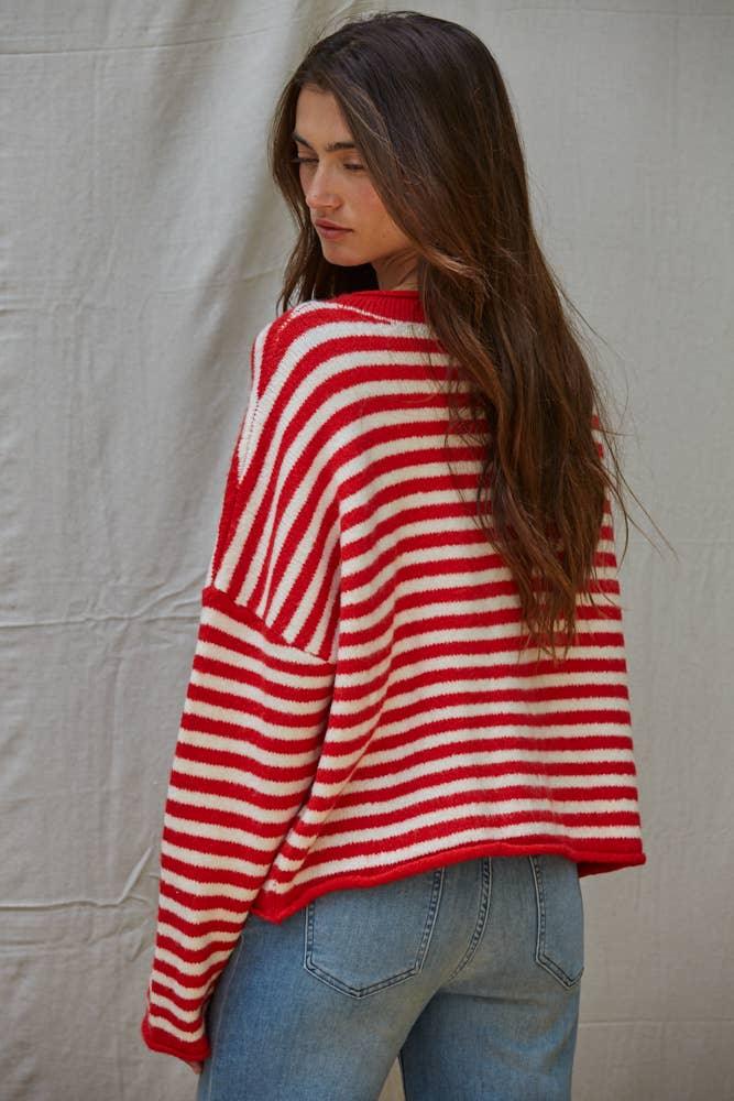 Red and white striped cozy sweater paired with jeans, perfect for coastal PNW adventures