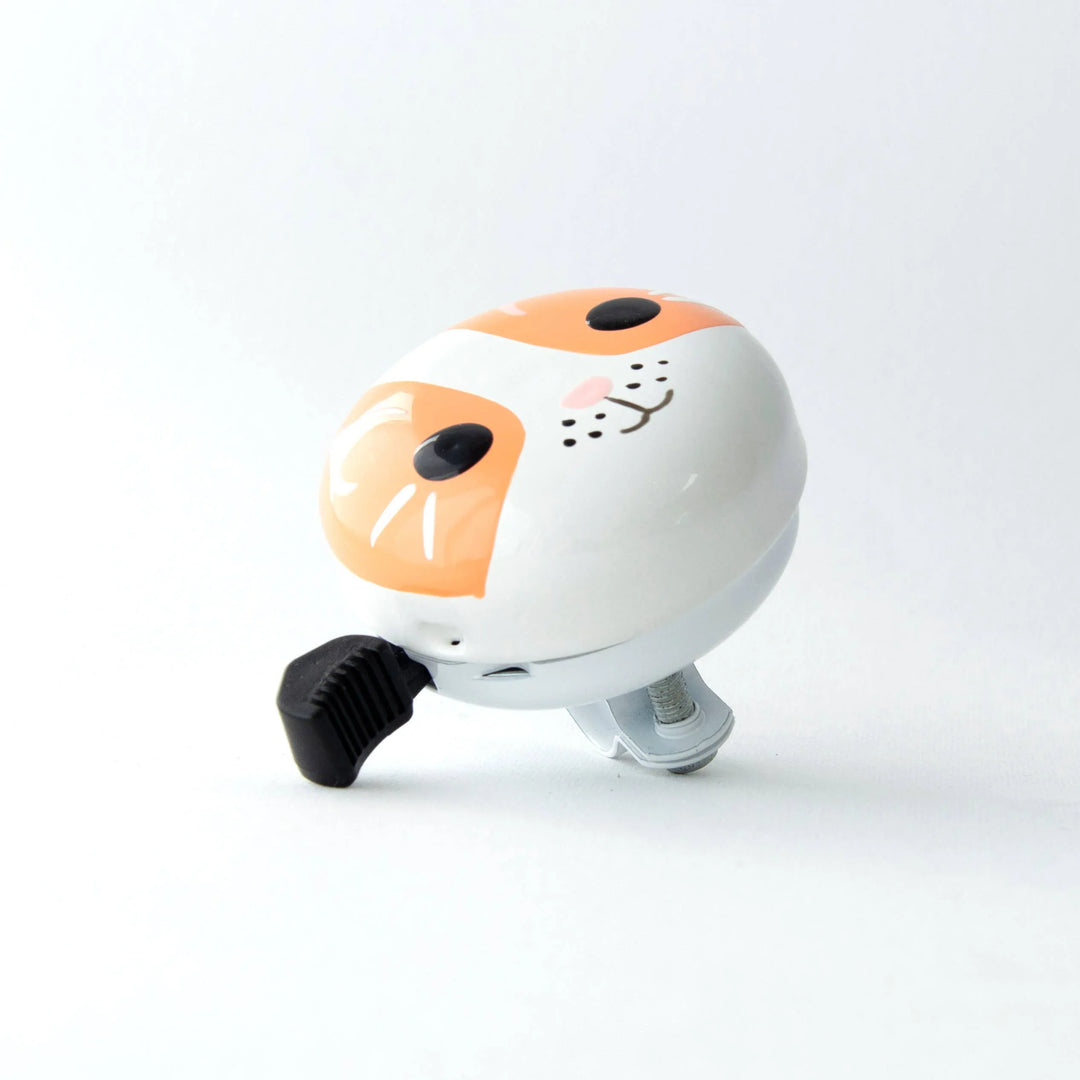 Cute cat-faced bike bell with orange and white design, perfect for kids&
