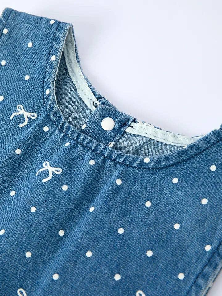 Blue denim baby dress with white polka dots and bow prints, snap button closure