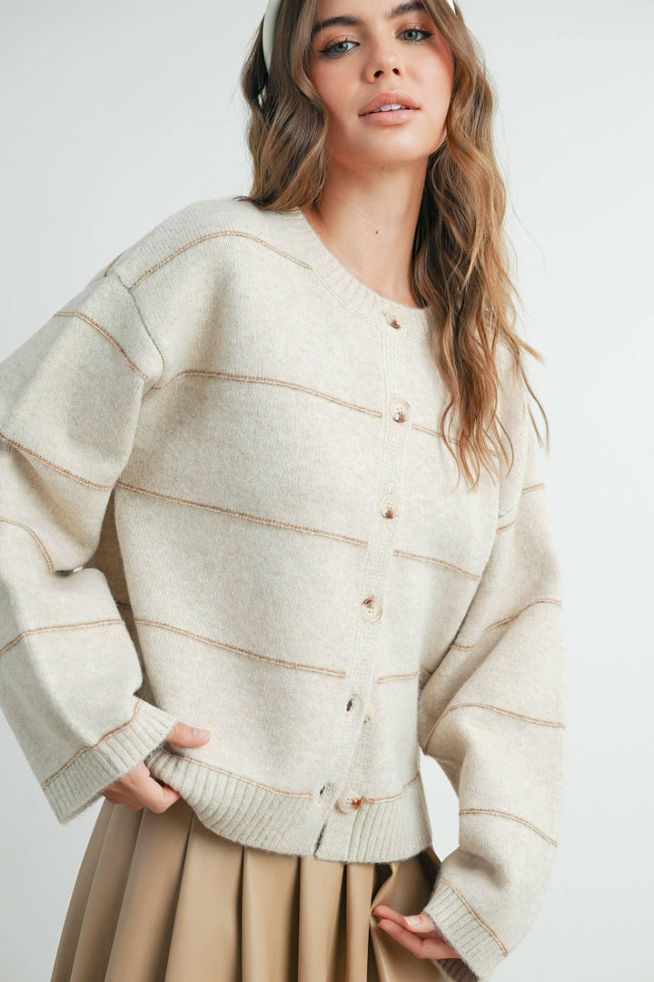 Cream button-front cardigan with contrast stitching, styled for coastal PNW weekends