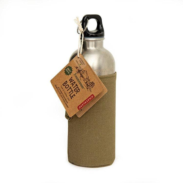 Stainless steel water bottle with olive canvas sleeve and rustic tag, perfect for outdoor adventures and coastal lifestyles.