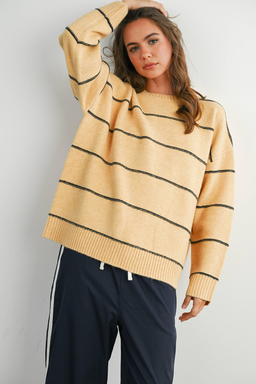 Yellow wavy striped sweater with ribbed cuffs, cozy coastal style for PNW adventures