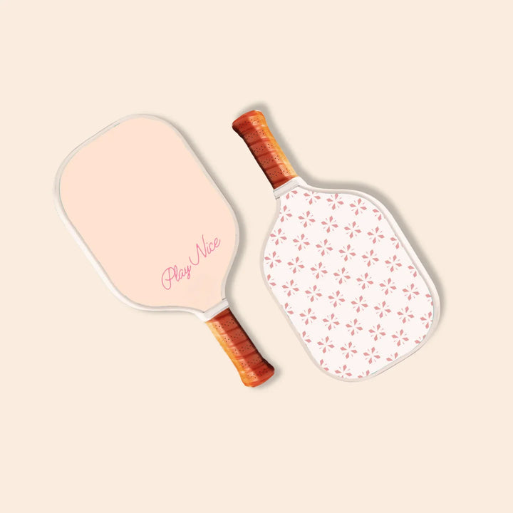 Two stylish pickleball paddles with floral pattern and &