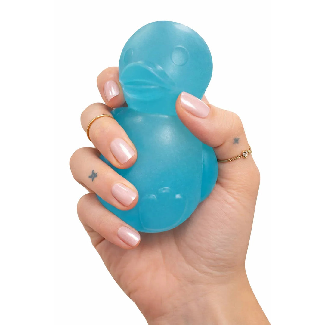 Hand holding blue rubber duck stress toy for outdoor fun and relaxation