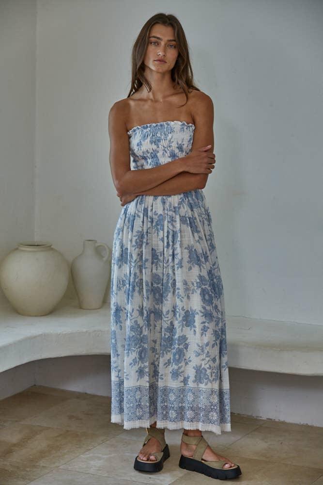 Blue floral strapless maxi dress with ruffled hem, styled for coastal summer days
