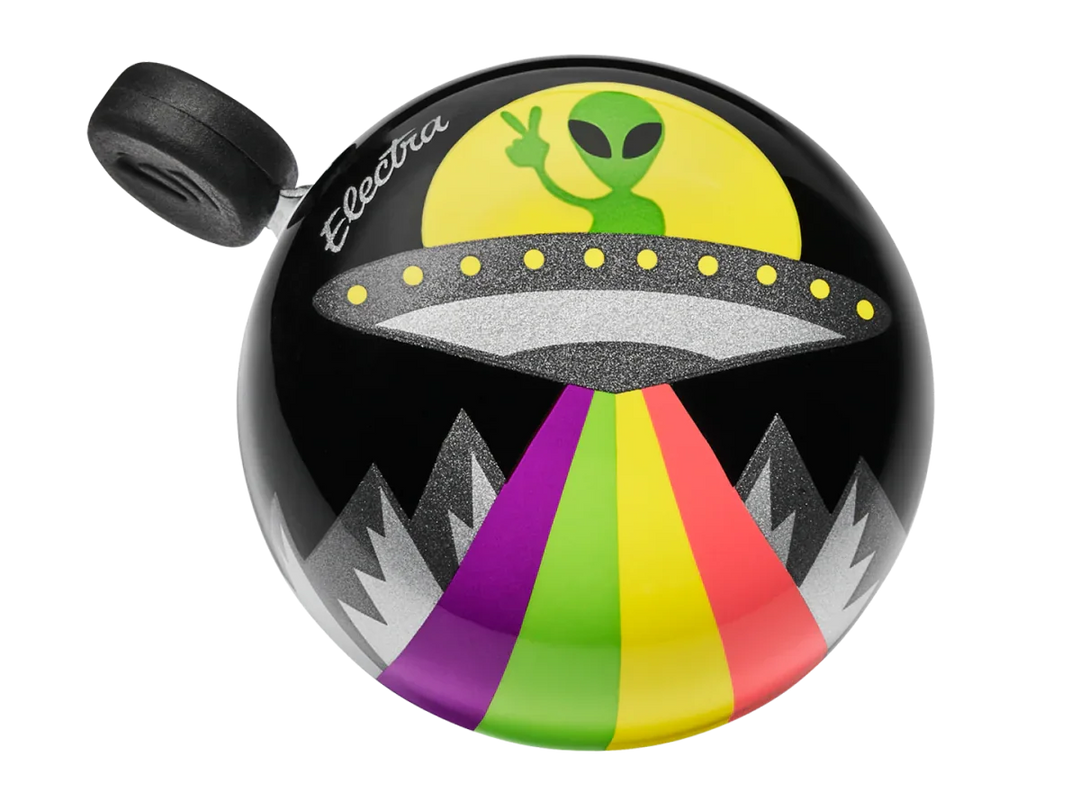 Trek Peace Out Bell featuring a UFO and alien with a rainbow beam over mountains