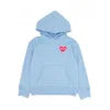 Light blue hoodie with small red heart on chest, perfect for PNW coastal adventures and everyday outdoor style