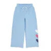 Light blue wide-leg pants with colorful heart patches, perfect for coastal PNW adventures and casual beach days.