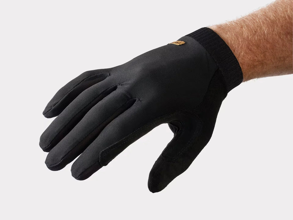 Black performance glove with textured grip, ideal for biking and outdoor adventures