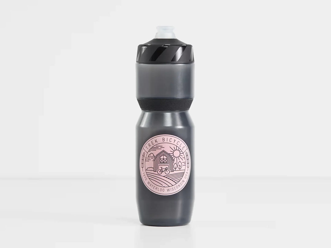 Trek Bicycle branded water bottle with barn and bike graphic, ideal for cycling adventures and outdoor lifestyle