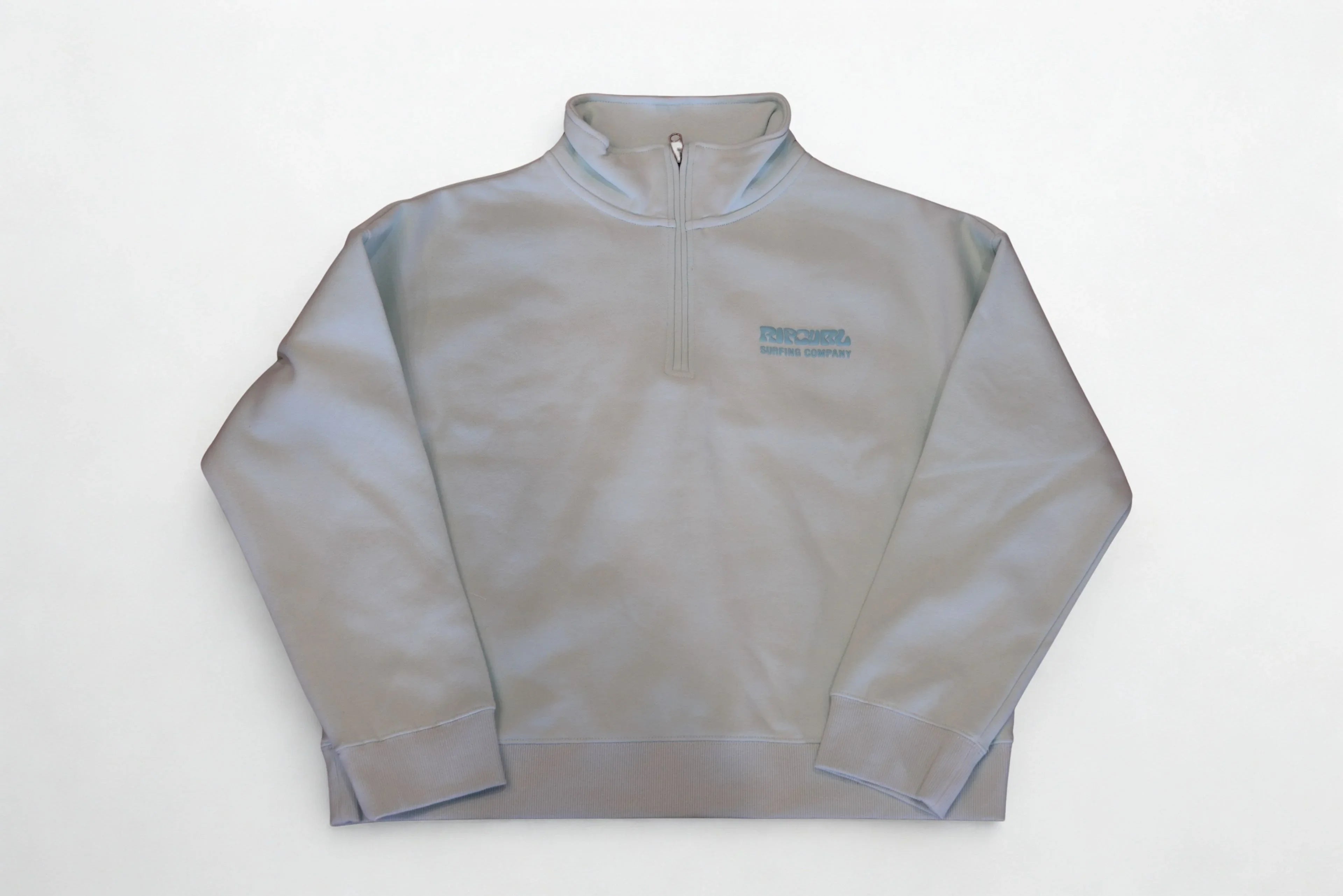 Light gray quarter-zip sweatshirt with subtle logo, ideal for casual or outdoor wear.