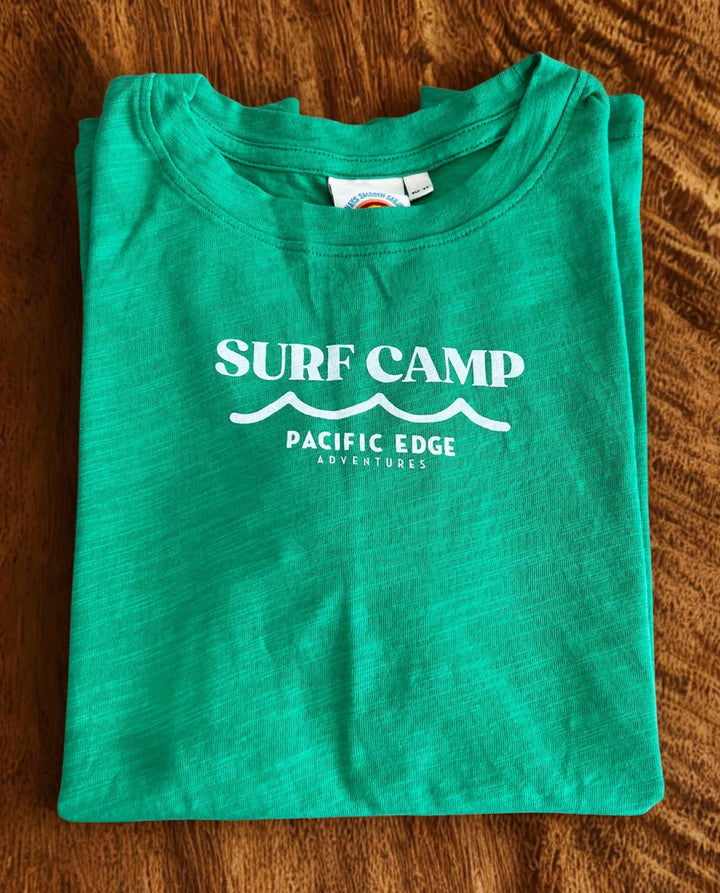 Green Surf Camp t-shirt with Pacific Edge Adventures print, ideal for coastal adventures and beach days.