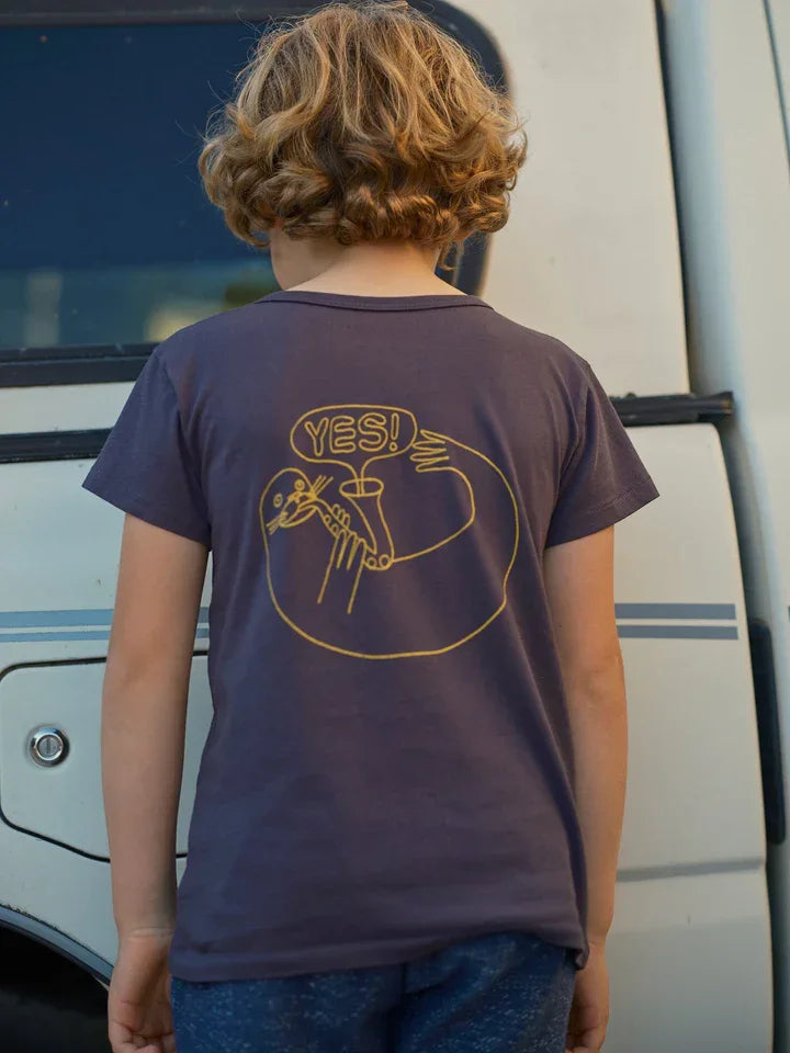 Child wearing navy t-shirt with &